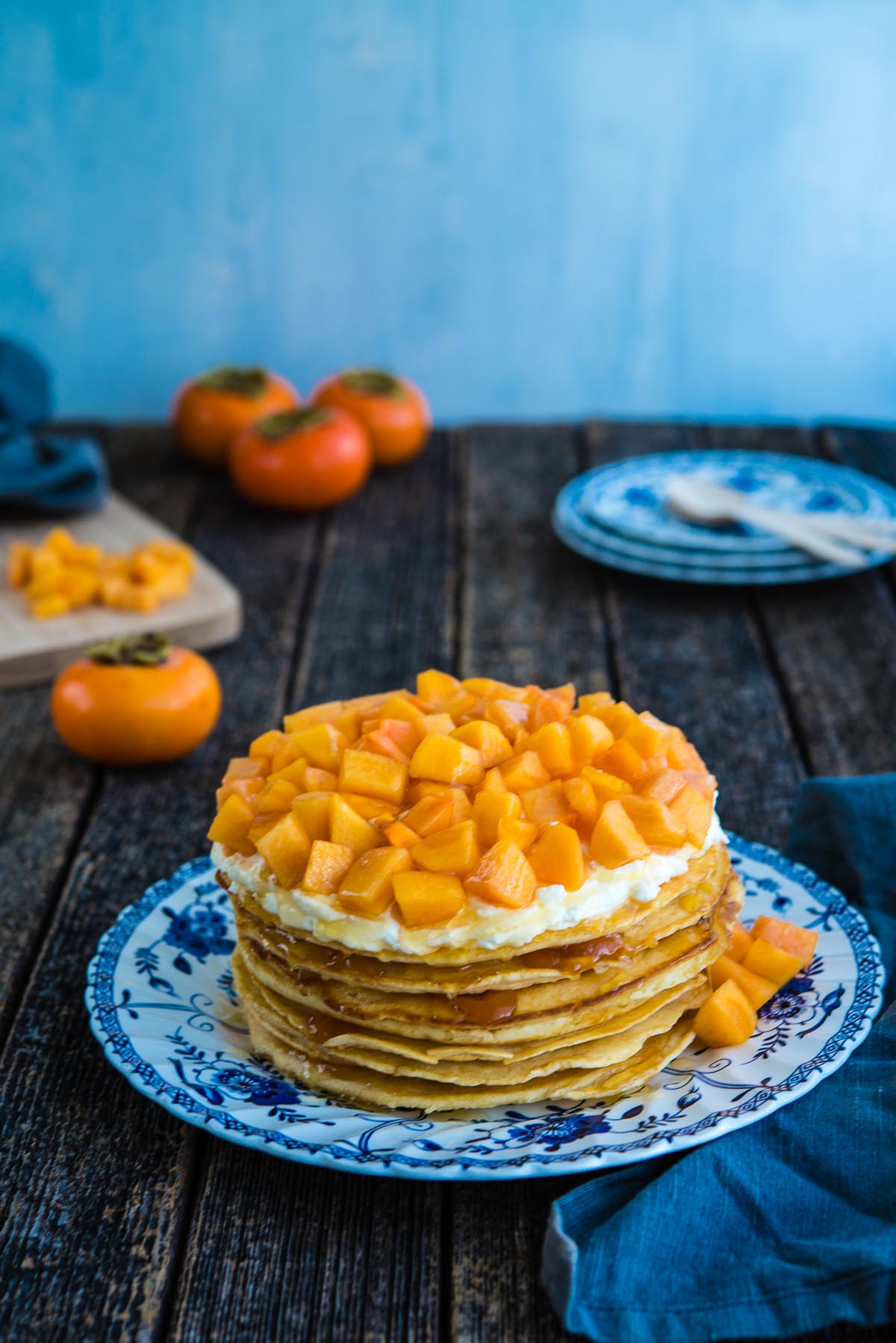 stacked pancake cake with persimmons
