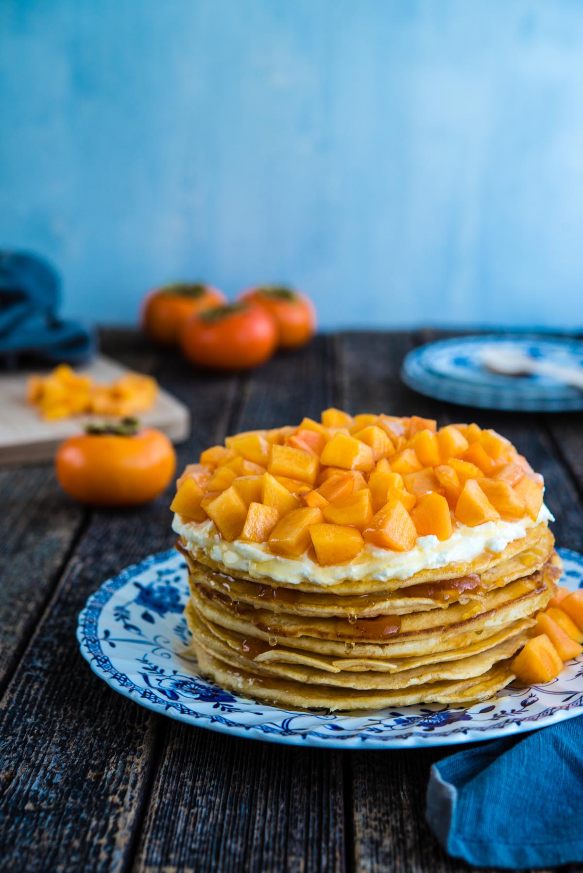 stacked pancake cake with persimmons