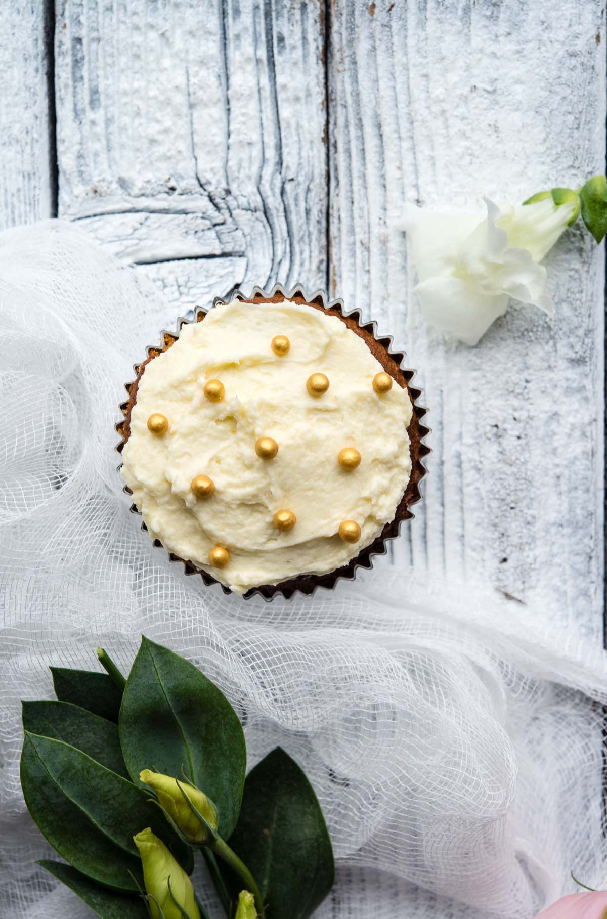 white chocolate cupcakes with gold sprinkles